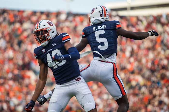 Auburn tight end Landen King (40) celebrates with Auburn wide receiver Kobe Hudson (5) after Hudson's touchdown against Alabama during the first half of an NCAA college football game, Saturday, Nov. 27, 2021, in Auburn, Ala. (AP Photo/Vasha Hunt)